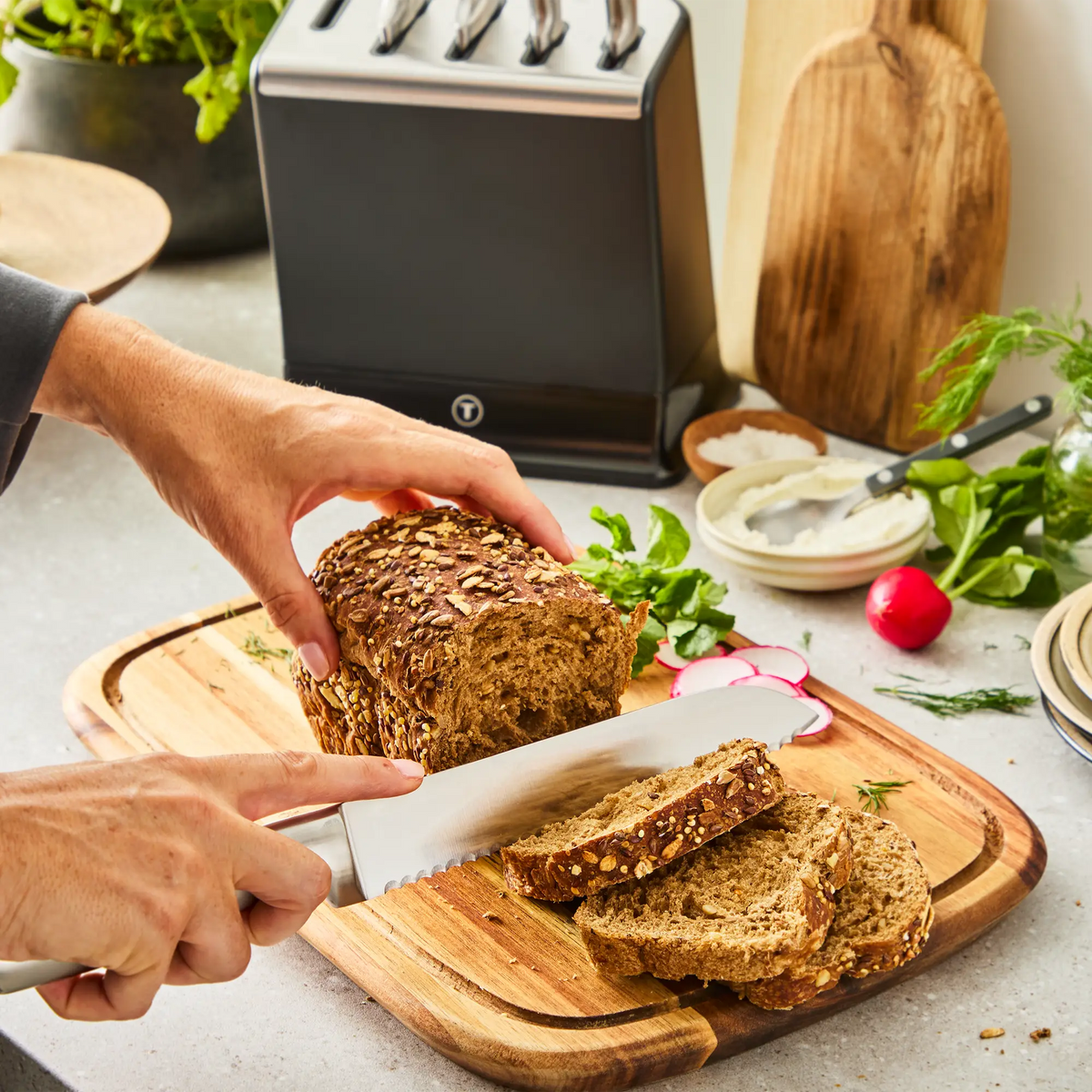 Tefal Eversharp Pro Stainless Steel Knife Block 6pc Set + Block with Integrated Sharpener - bread knife cutting bread on board
