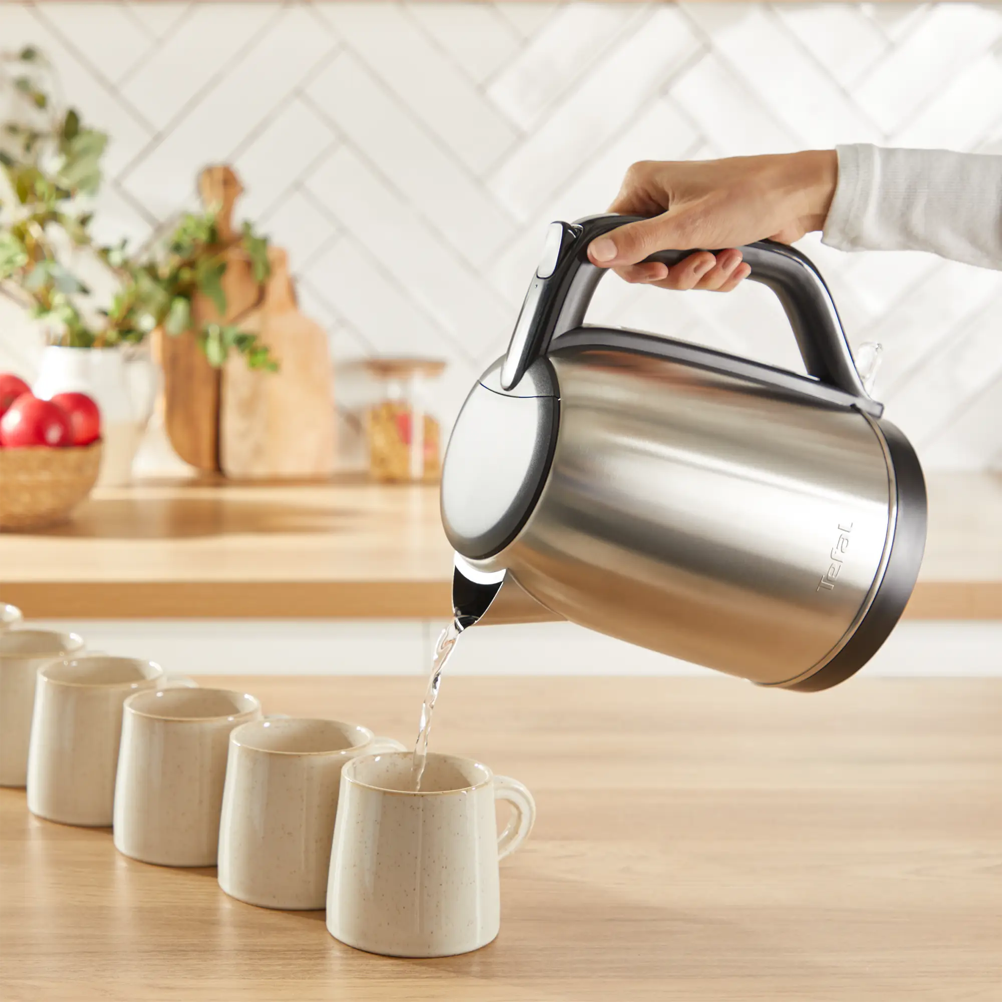 Tefal Subito Stainless Steel Toaster & Kettle Breakfast Set TT5SAD in use pouring boiling water