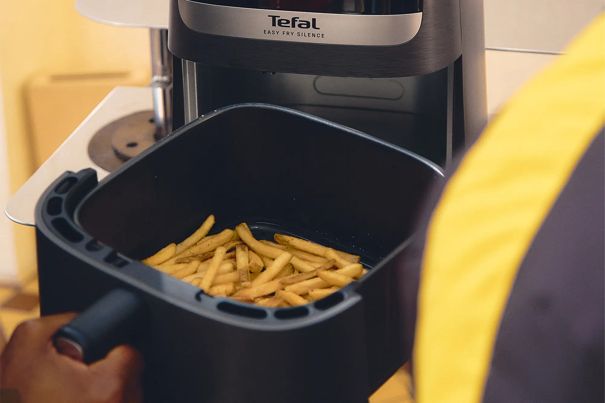 Hot chips being prepared by Chris Theodosi & Jesse Orleans in a the Tefal Easy Fry Silence Air Fryer