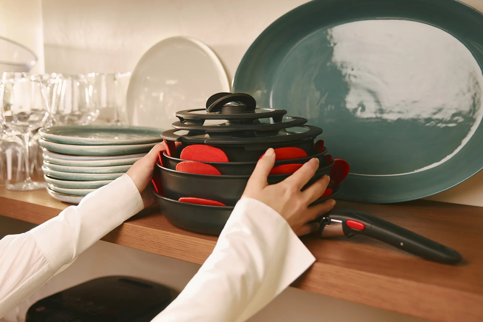 Tefal Ingenio cookware set stacked on shelf
