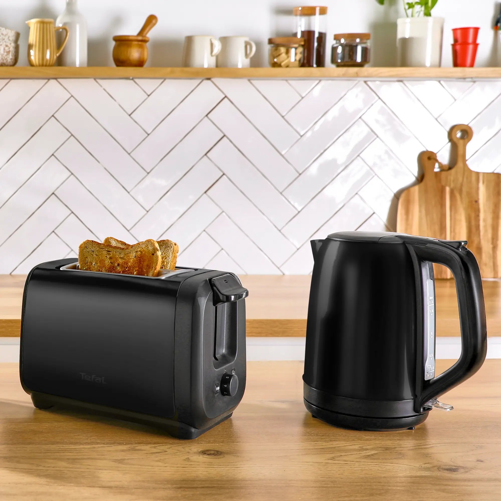 Tefal Subito Black Stainless Steel Toaster & Kettle Breakfast Set with toast in toaster