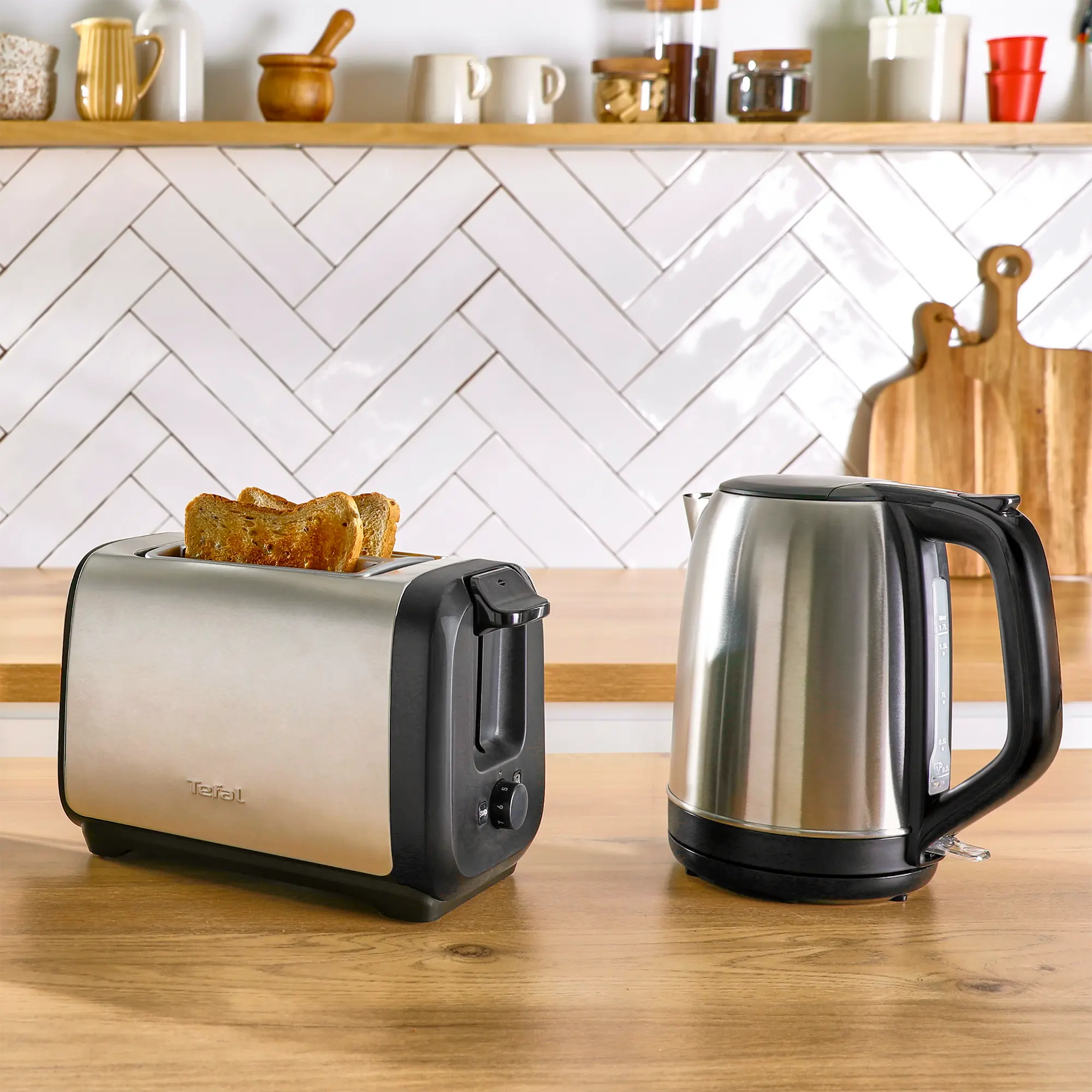 Tefal Subito Stainless Steel Toaster & Kettle Breakfast Set TT5SAD with toast in toaster