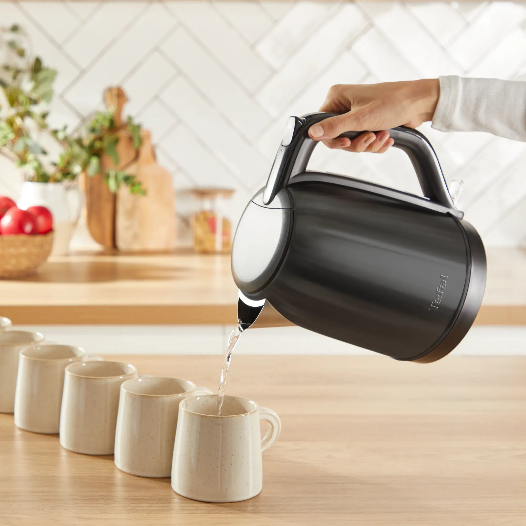 Tefal Subito Black Stainless Steel Toaster & Kettle Breakfast Set pouring hot water