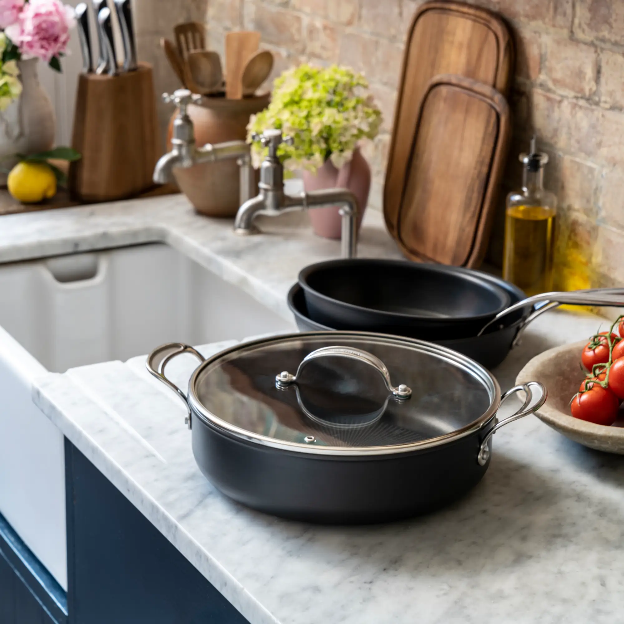 Jamie Oliver by Tefal Cooks Classic Induction Non-Stick Hard Anodised All-In-One Pan 30cm + Lid on kitchen bench